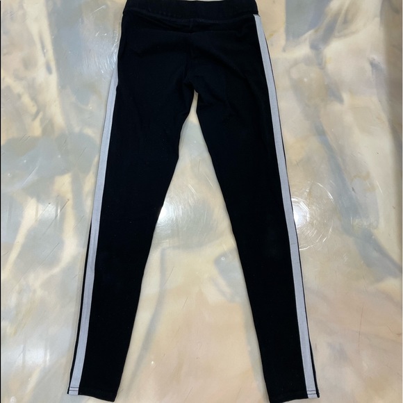 Garage black leggings with 2 white stripes on each side of the leg. - Picture 2 of 4